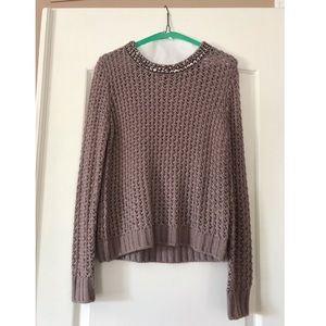 mauve sweater with beaded neckline.